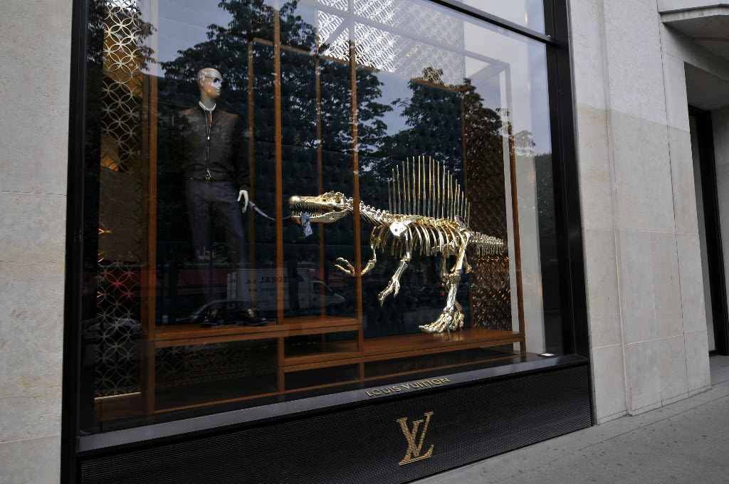louis vuitton's gilded dinosaur skeleton window installation